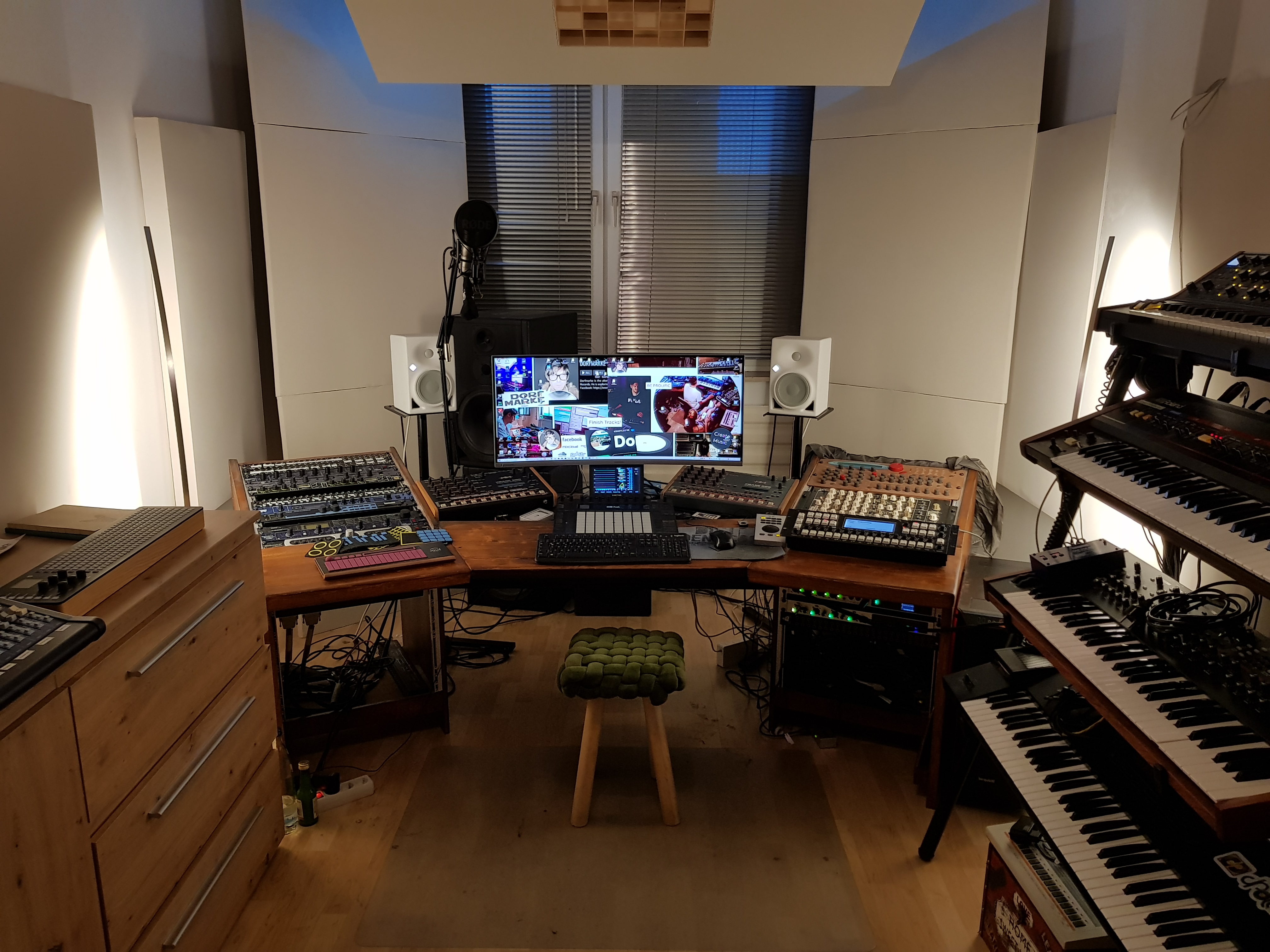 Past Dorfmarke studio setup with synthesizers, drum machines, sequencers, and monitoring equipment.